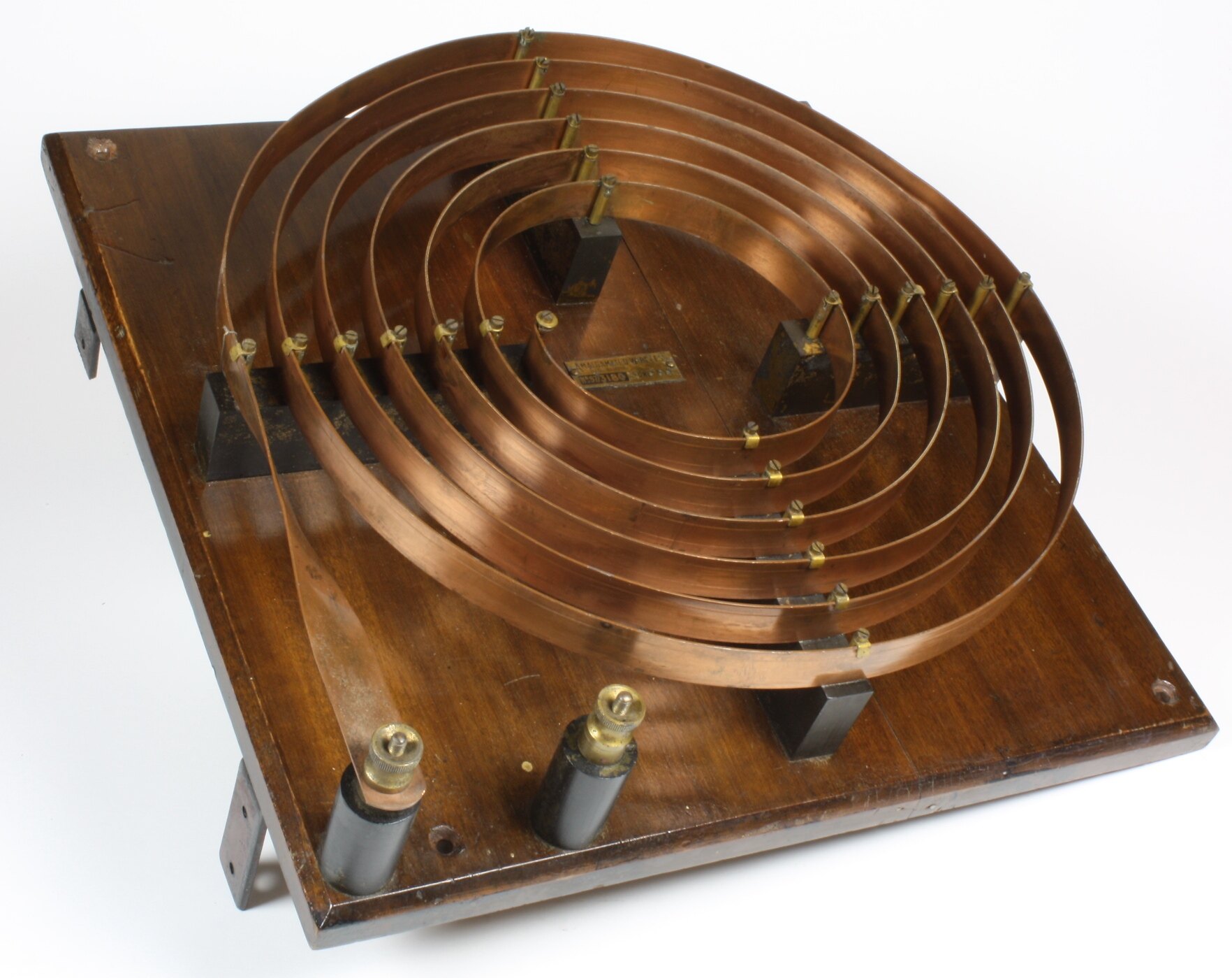 Copper strip high-frequency tuning coil on a walnut base, made by AWA between 1914 and 1920